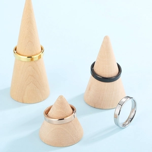 Classic stainless steel bands in gold, black, rose gold, and silver on wood stands