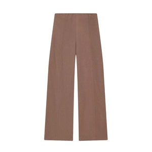 Detailed view of women's brown wide-leg trousers with soft texture and elastic waist
