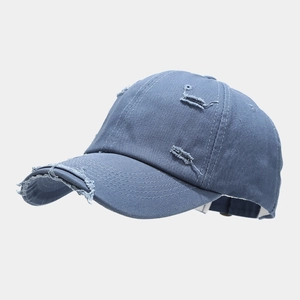 Distressed vintage grey-blue denim baseball cap with frayed hole details and curved brim