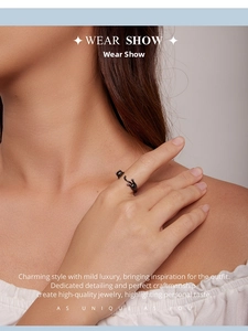 Close-up of a creative S925 sterling silver black cat open ring worn on a finger