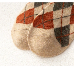 Close-up of diamond pattern and soft texture on brown wool blend crew socks