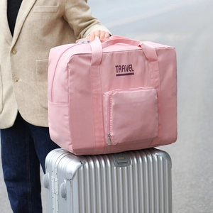 Pink large capacity travel bag on silver suitcase trolley with Travel lettering