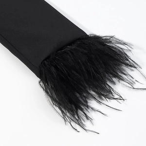 Detail of elegant black blazer sleeve featuring premium fluffy feather trim decoration
