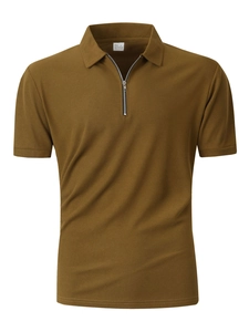 Close-up of brown waffle textured fabric and half-zip collar on men's polo shirt
