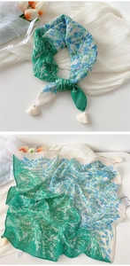 Detail of floral cotton linen square scarf with tassels and green ivory pattern