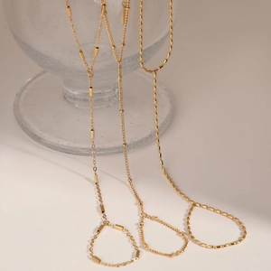 PVD gold plated stainless steel slave bracelet featuring bead and link chain designs