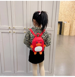 Detail shot of the cute red duck backpack for toddlers with adjustable shoulder straps
