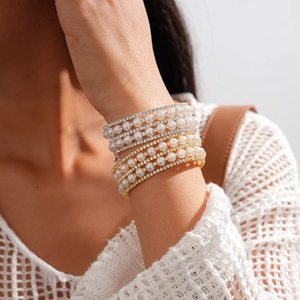 Elegant multilayer faux pearl and rhinestone cuff bracelet in gold and silver finish