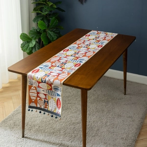 Modern jacquard table runner featuring colorful cartoon fish patterns and blue tassels