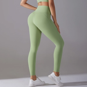 Close-up of light green high-waisted yoga pants with seamless butt-lifting stitch detail