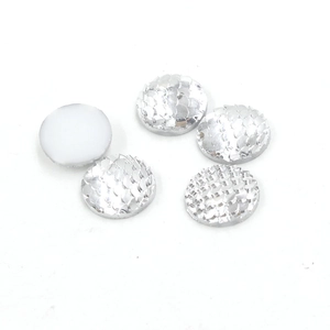 Macro view of 14mm silver round resin fish scale flatback cabochon craft pieces