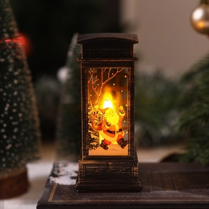 Macro view of bronze Christmas telephone booth lantern with Santa Claus pattern and LED light