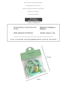 Detail view of candy-colored elastic hair ties set with cartoon charms and beads