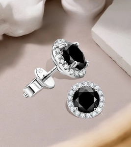 Macro detail of S925 silver black moissanite stud earring with halo setting