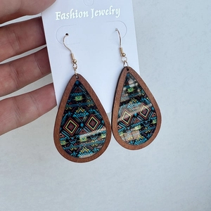Detail of colorful Aztec teardrop earrings with wood frame and gold hooks
