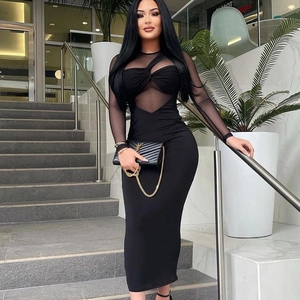 Women's black bodycon dress featuring mesh patchwork sleeves and front twist detail