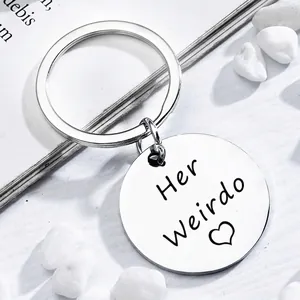 Polished silver stainless steel keychain with Her Weirdo engraving and heart pattern