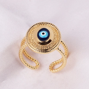 Vintage gold open ring with mystic evil eye motif and wave-shaped double band design