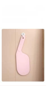 Pink bed sheet tucker tool with ergonomic handle and hanging hole for easy storage