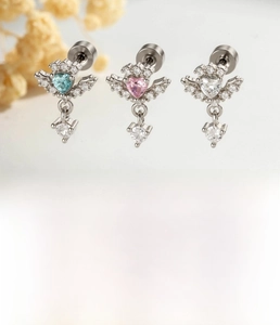 Detail of silver heart ear studs with pink, blue, and white zircon on steel screw posts