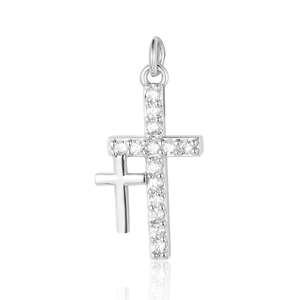 Macro view of double silver cross pendants with embedded clear zircons on white background