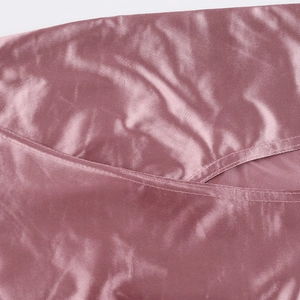 Detailed close-up showing high-quality velvet fabric and precise stitching on pink dress