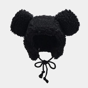 Cute black plush sherpa hat with bear ears and braided chin straps for winter warmth