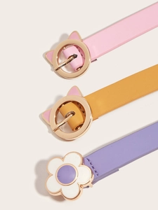 Detail of pink, yellow, and purple kids' belts with cat-ear and flower metal buckles