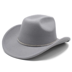 Close-up of grey felt western hat featuring a wide brim and sparkling rhinestone band
