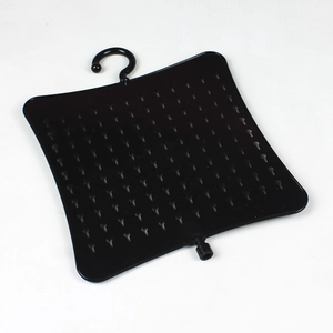 Detail view of the black rotating jewelry rack with multi-hole grid for earrings