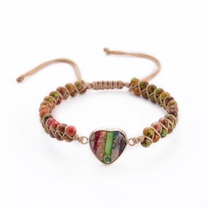 Detail of hand-woven bracelet with heart stone pendant and colorful natural beads
