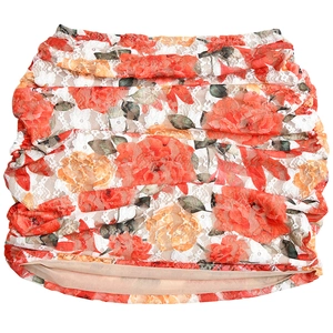 Detail of red and orange floral lace fabric with elegant pleated design and beige lining