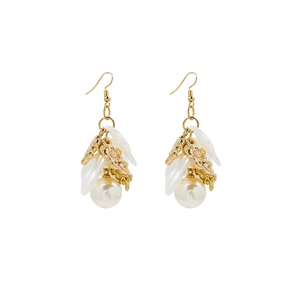 Detail of French vintage gold earrings with white petals and elegant round pearls