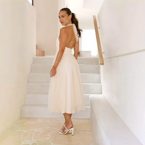 Elegant white halter neck backless mesh dress with layered hem for formal weddings