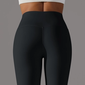 Detail of high waist yoga leggings showing seamless V-shaped stitching and butt lift effect