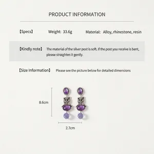 Macro shot of vintage purple cat earrings with rhinestone accents and measurements