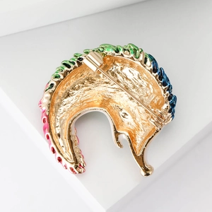 Back view of gold-plated hedgehog brooch with colorful enamel and secure pin clasp