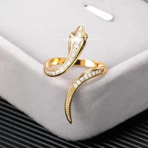 Gold snake ring with sparkling zircon stones in a jewelry box for a trendy hip-hop style