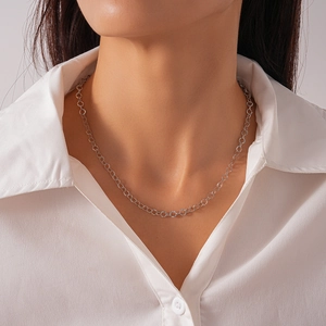 Detailed close-up of a silver geometric round link collar chain necklace for women