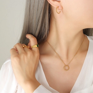 Gold plated twisted ring jewelry set with green gemstone signet ring and necklace