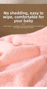 Close-up of pink soft coral fleece baby towel showing non-shedding microfiber texture