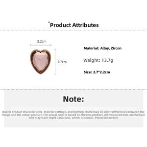 Macro detail of a 2.7x2.2cm heart-shaped pink zircon pendant with silver alloy frame