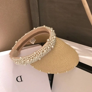 Handmade straw sun visor hat with elegant pearl embellishments for summer beach outings