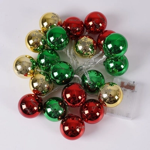 Close-up of multicolored LED Christmas ball string lights with Merry Christmas lettering