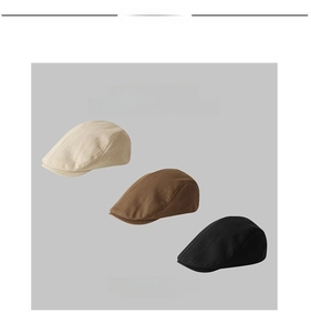 Detail view of retro newsboy caps in beige, brown and black with cotton linen texture