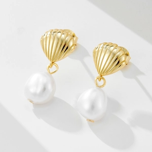 Elegant S925 sterling silver shell stud earrings with irregular white freshwater pearls