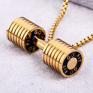 Detailed view of a golden dumbbell pendant featuring black rings and GO FIT engraving