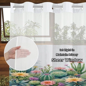 Detail of sheer window curtain featuring cactus floral prints and silver metal grommets