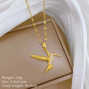 Detailed view of hummingbird pendant with pink zircon eyes and gold chain dimensions