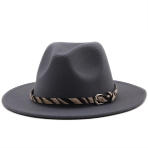Detail of dark gray wool fedora hat with zebra pattern band and metal buckle
